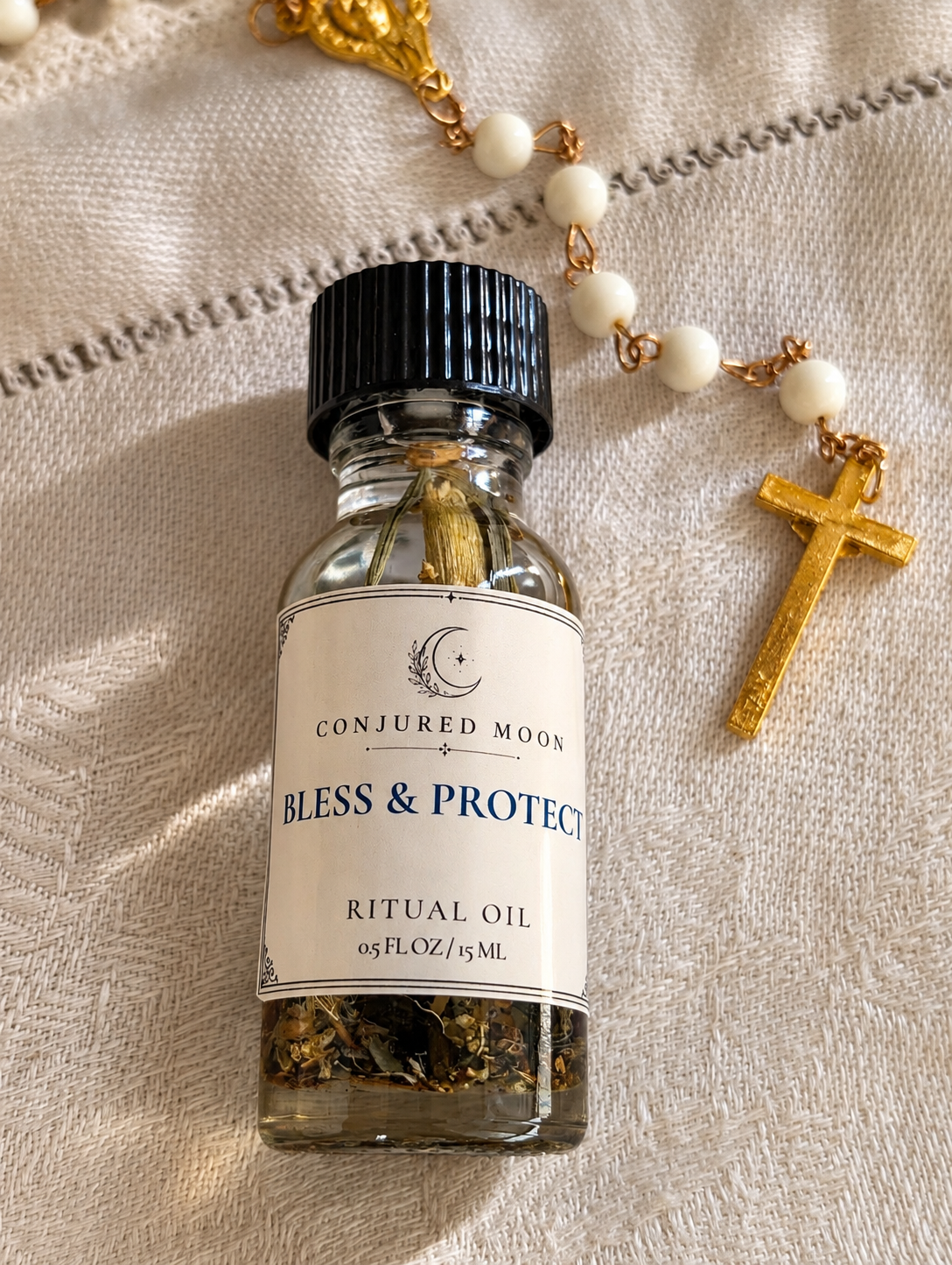Bless & Protect Spiritual Oil by Conjured Moon with rosary and cross